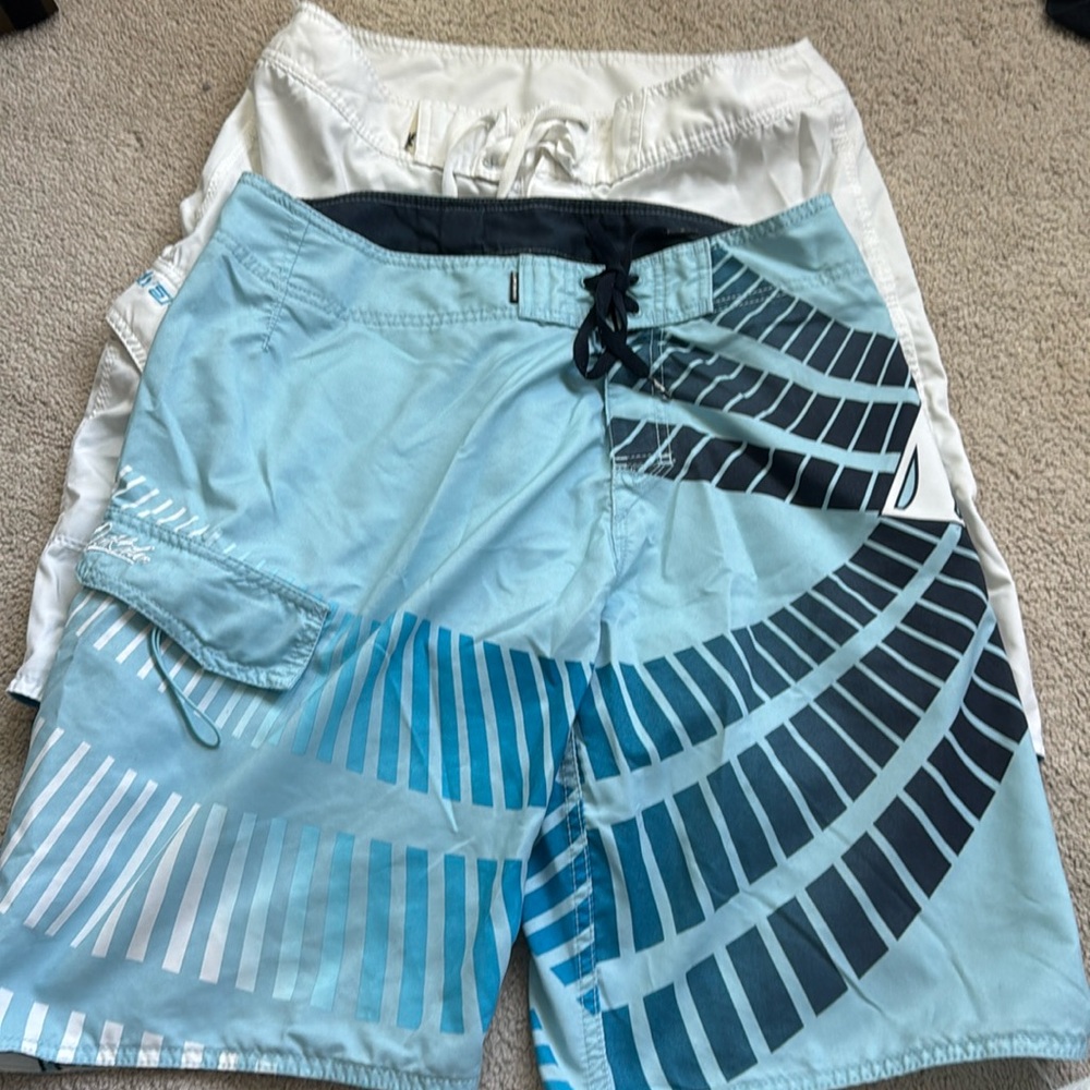Two Quicksilver board shorts size 32